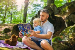 Father reading with his daughter.