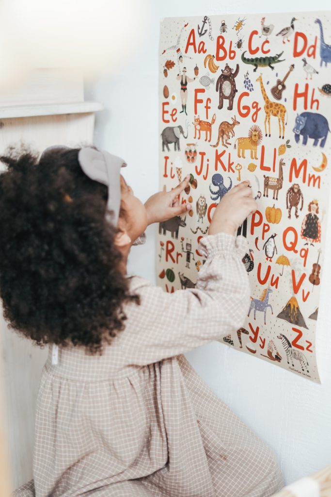 little girl learning the alphabet